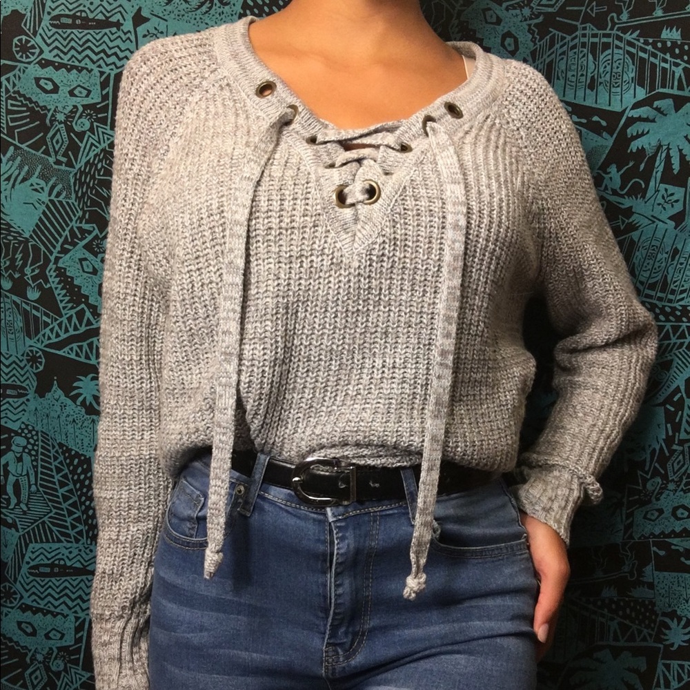 Grey lace up sweater.